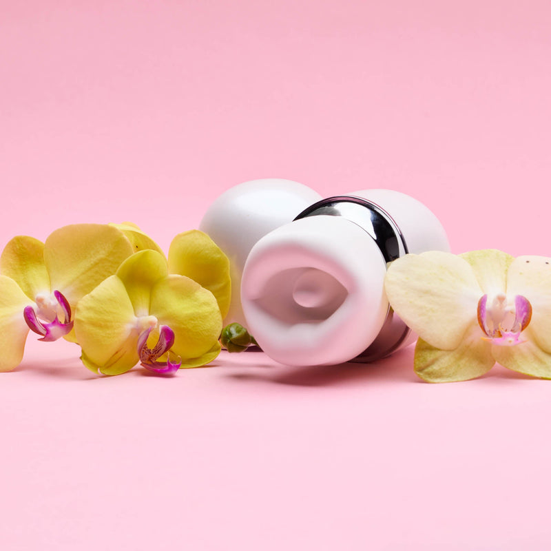 CoCo clitoral stimulator styled with yellow orchid flowers, LemmeSensa